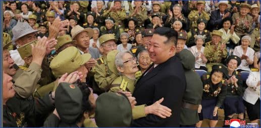 Respected Comrade Kim Jong Un Meets and Has Photo Taken with War Veterans and Persons of Wartime Merit