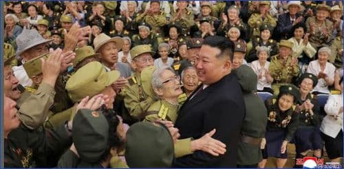 Respected Comrade Kim Jong Un Meets and Has Photo Taken with War Veterans and Persons of Wartime Merit